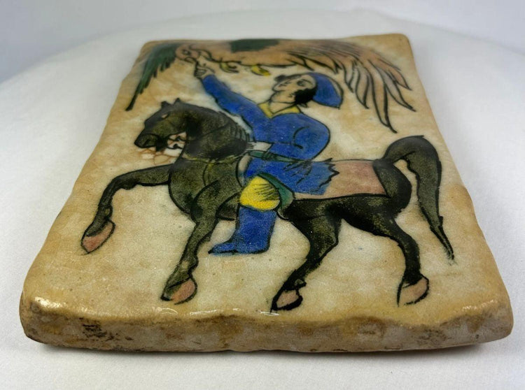 Hand-painted Qajar ceramic tile showing falconry imagery on horseback