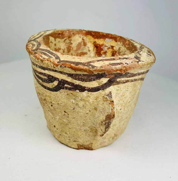 Close-up detail of black slip decoration on a 12th-century Islamic pottery mortar