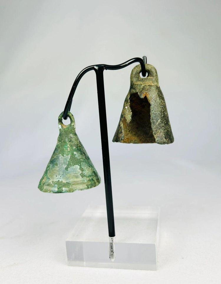 Roman harness or ritual bell in cast bronze, displaying natural burial patina and conical shape