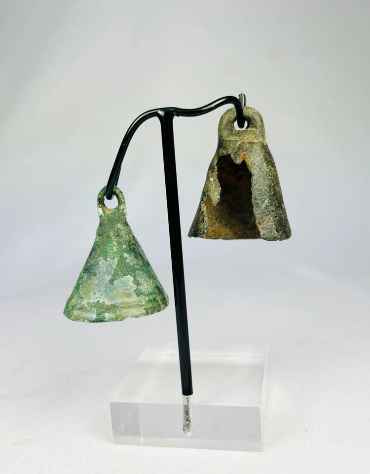 Roman harness or ritual bell in cast bronze, displaying natural burial patina and conical shape