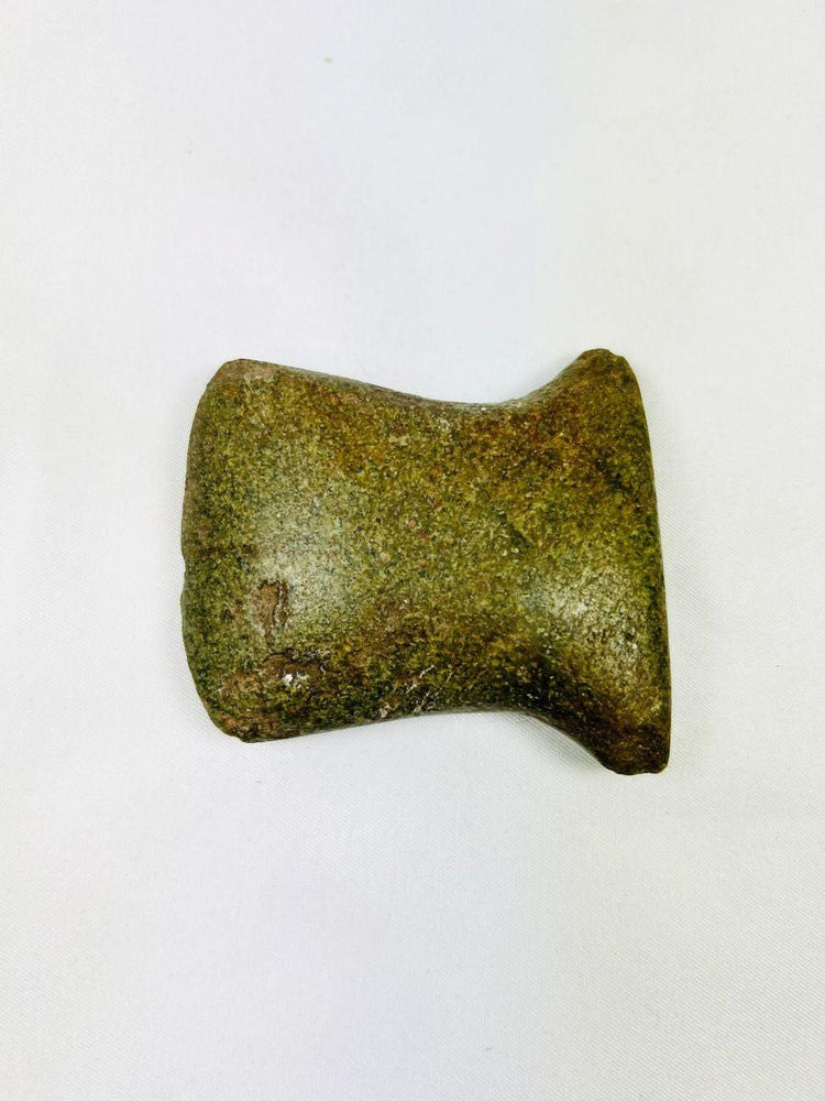 Pre-Columbian notched axe from Ecuador/Peru, showing wear from daily utilitarian use.