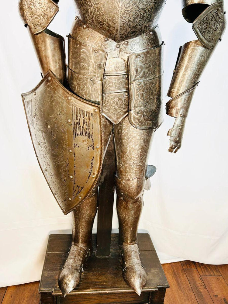 Victorian Gothic-inspired suit of armor with scrolling foliage and mythical motifs