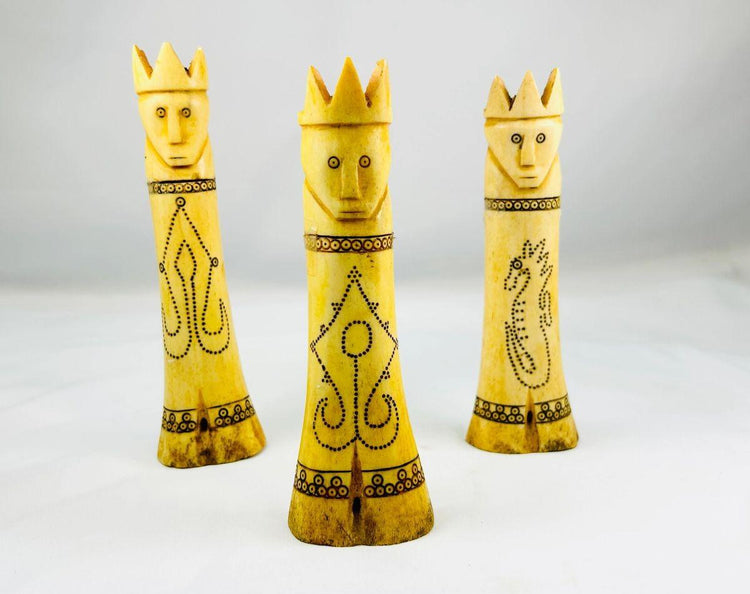 Antique Indonesian lime containers with intricate scrimshaw motifs and royal lids