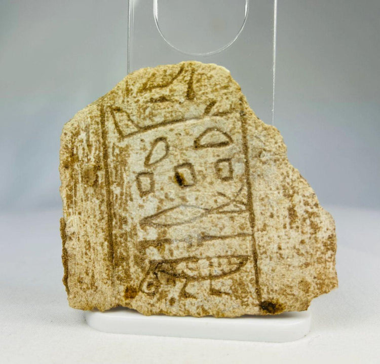 Ancient Egyptian carved limestone fragment with hieroglyphic inscriptions, 7th century BCE.
