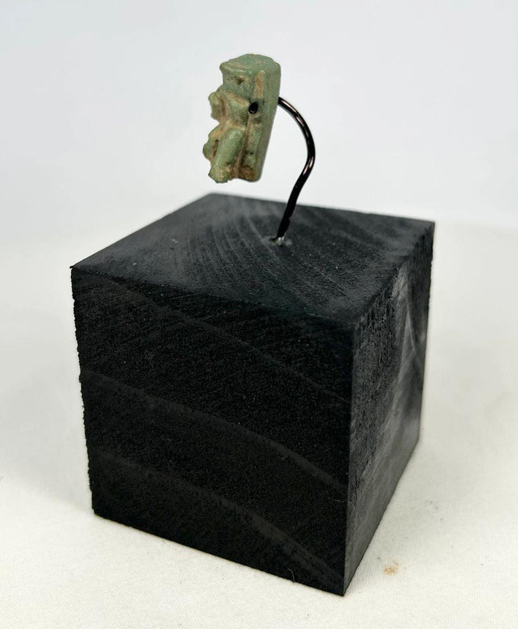 blue green egyptian goddess amulet symbolic of protection