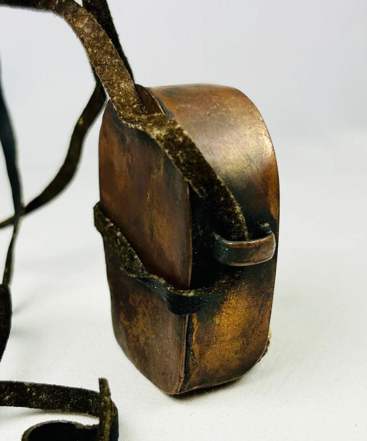 Rear view of Tibetan Gau box showing removable back panel and aged patina.