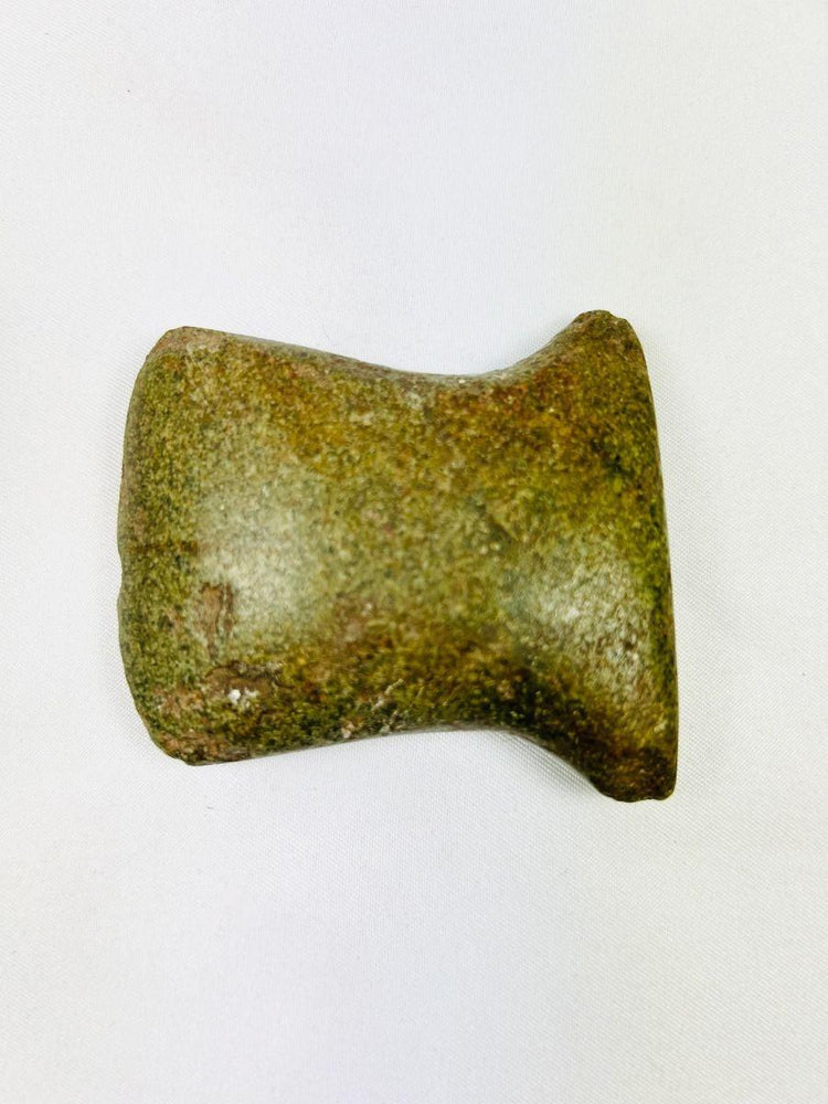 Pre-Columbian Andean tool with beveled edge and wear marks, original archaeological tag included.