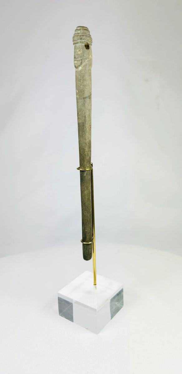 Human-headed stone idol from ancient Bactria, slender form with dual faces and centuries-old surface wear.