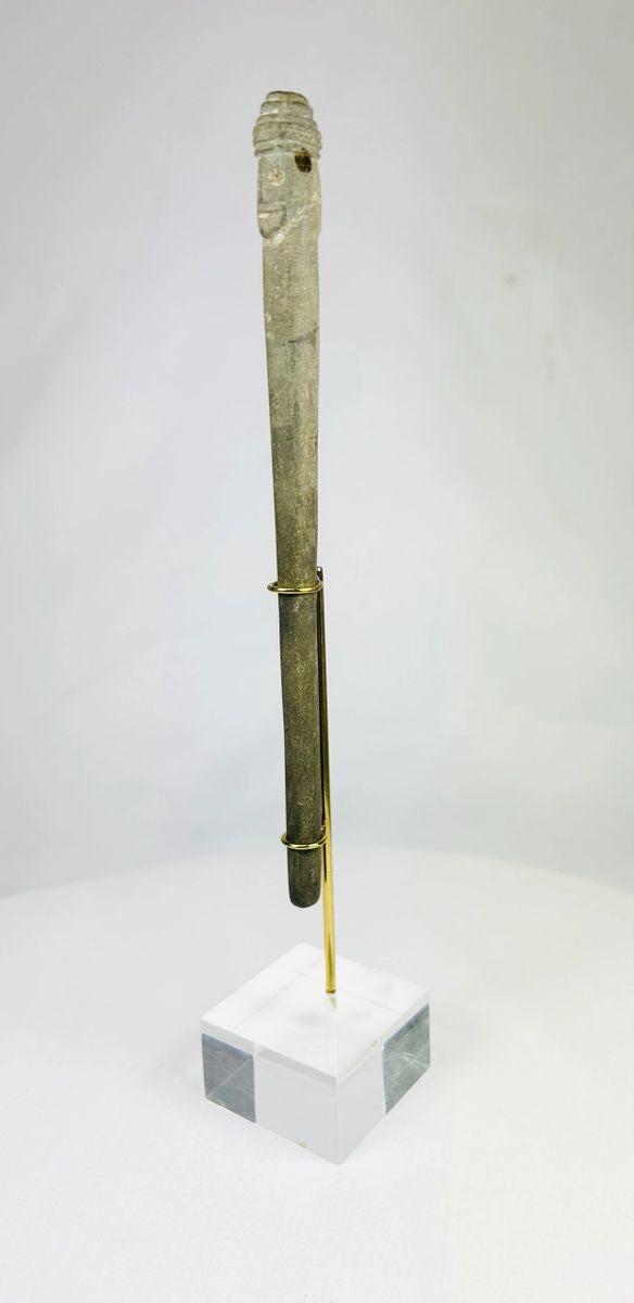 Human-headed stone idol from ancient Bactria, slender form with dual faces and centuries-old surface wear.