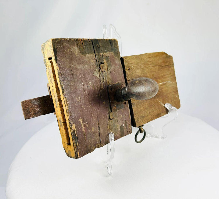 Detail view of aged hardwood lock body with original wrought iron hardware