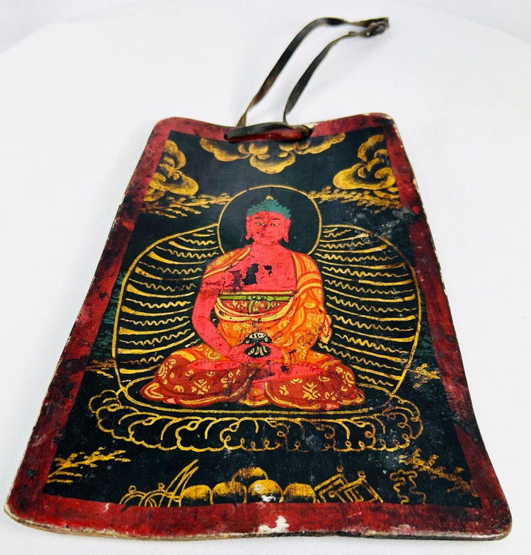 Front view of a 19th-century Tibetan devotional bone amulet with lotus throne imagery