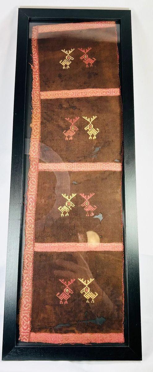 Detail of natural red and yellow dyes on an Andean textile fragment