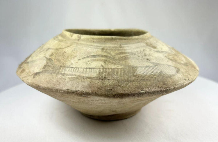 Archaeological terracotta bowl from the Indus Valley with preserved painted decoration.