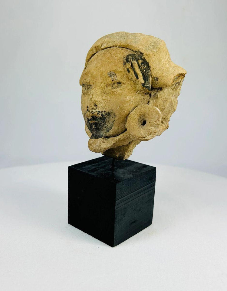 Late Classic Mesoamerican ceramic piece with sculpted human face