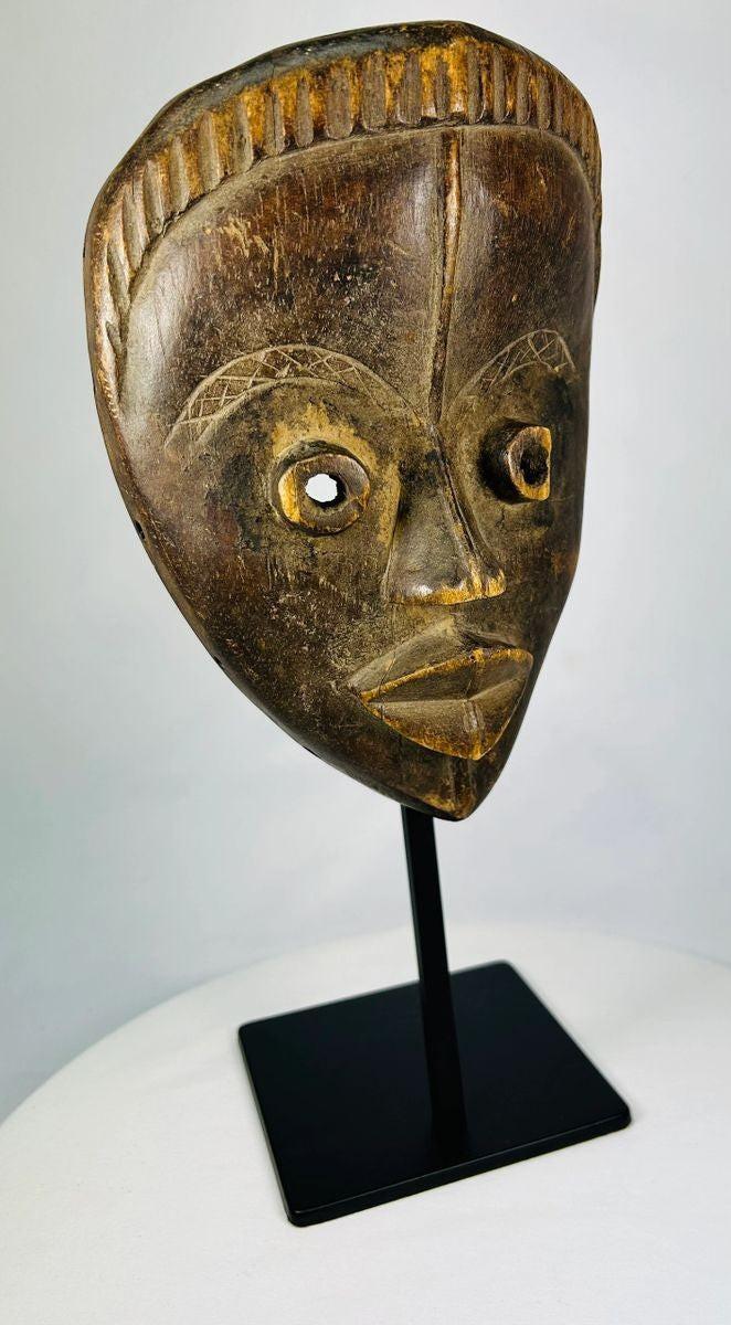 Classic Baule mask exemplifying balance and idealized beauty in West African art