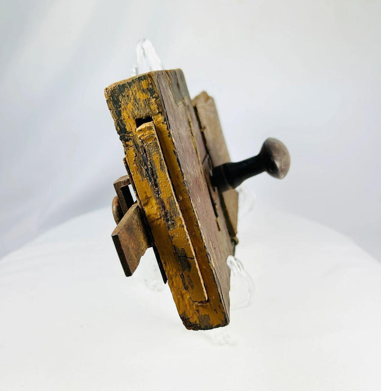 Antique colonial wooden lock displaying centuries-old surface wear and patina