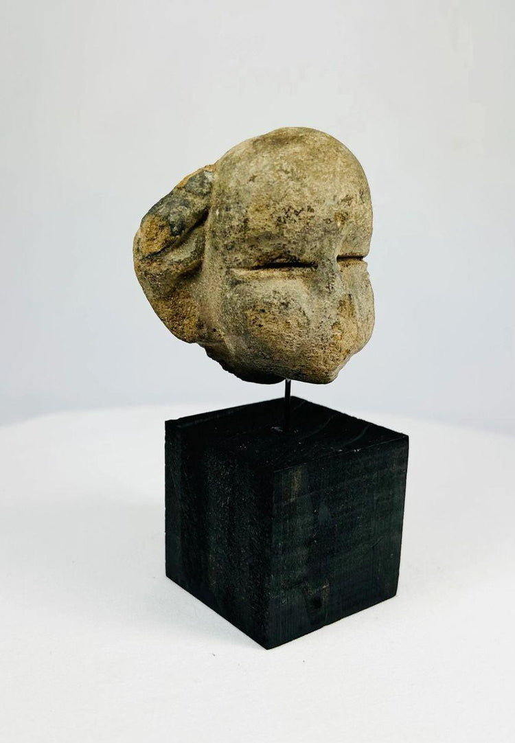 Antique Mesoamerican mask fragment carved from single stone block