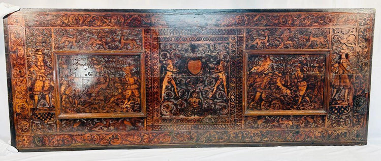 Renaissance hardwood carving showing hunters, animals, and mythological motifs in deep relief, 16th–17th century.