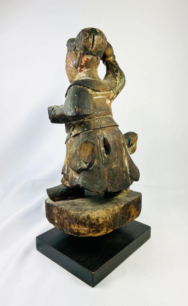 Historic Qing Dynasty temple guardian statue with raised arm, ornate armor, and worn red-gold pigment, 11-inch carved wooden figure.