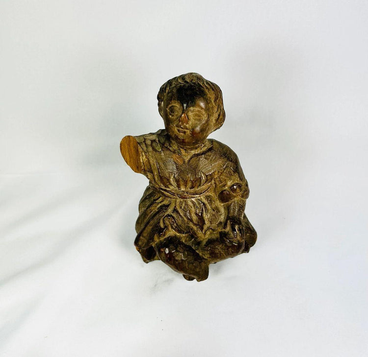 Hand-carved Spanish Colonial folk art figurine with expressive face and draped clothing