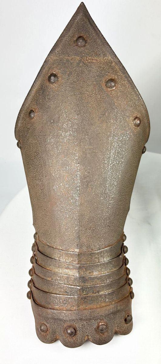 Pair of historic-style gauntlets with weathered metalwork and Gothic decorative elements.