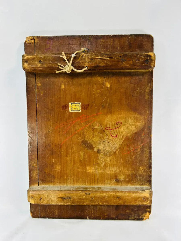 Back of antique Orthodox icon panel with wooden cross-bracing, aged patina, rope hanger and remnants of old label