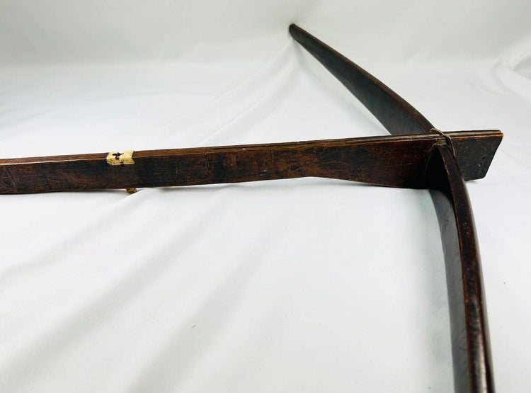 Authentic Yunnan tribal crossbow stock displaying bone toggle attachment and patina.