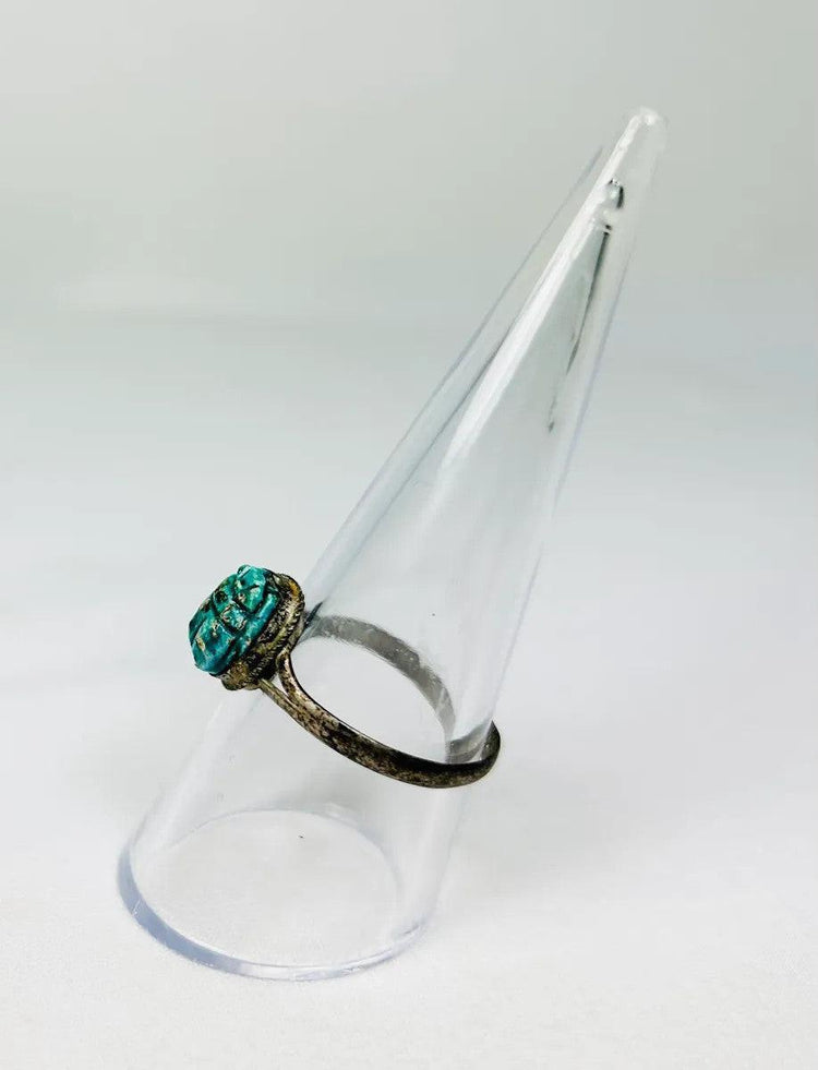 ancient egyptian turquoise green scarab ring on display stand