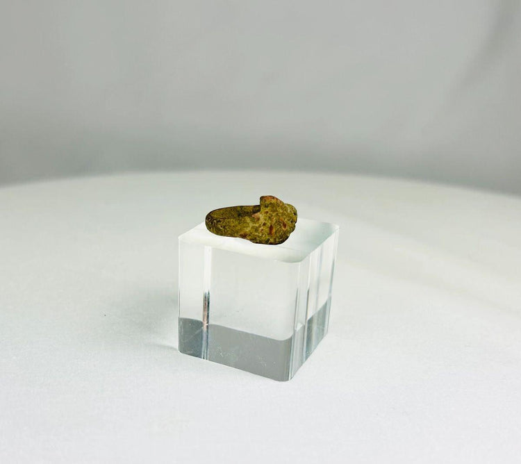 Profile view of a bronze ring from antiquity illustrating form and craftsmanship