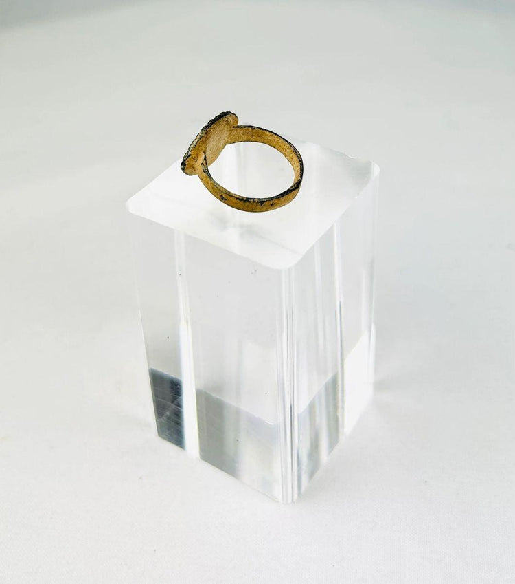 Side view of an authentic Roman bronze ring showing centuries-old burial patina