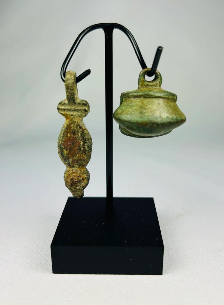 Museum-quality Ancient Roman bronze pendant photographed against a neutral background