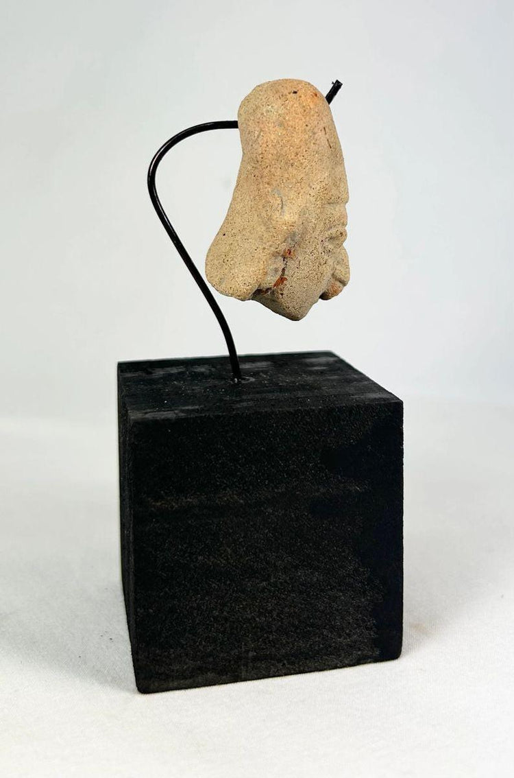 West Mexican terracotta pendant head with detailed facial features