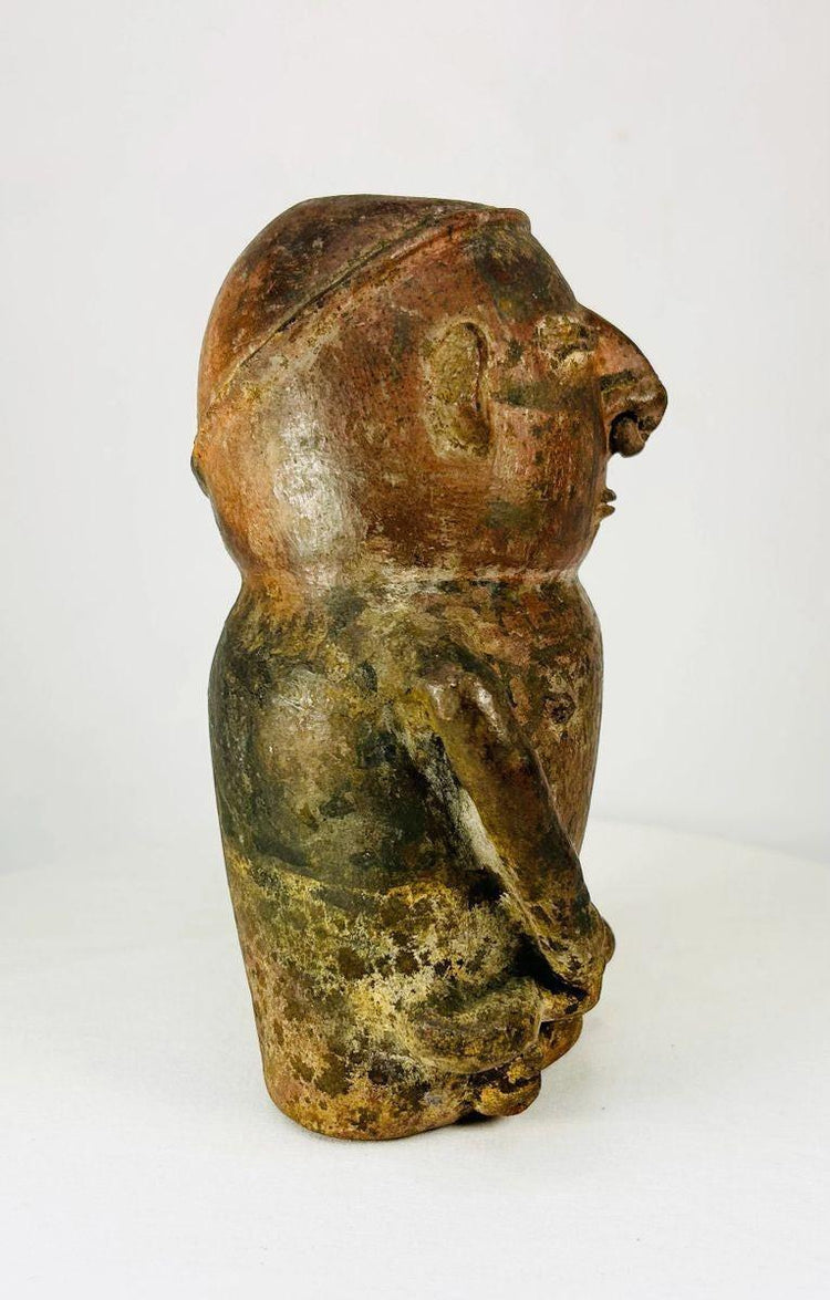 Pre-Columbian anthropomorphic terracotta vessel — side profile showing molded hands and ceremonial figure, ancient effigy pottery at Relic and Rarity