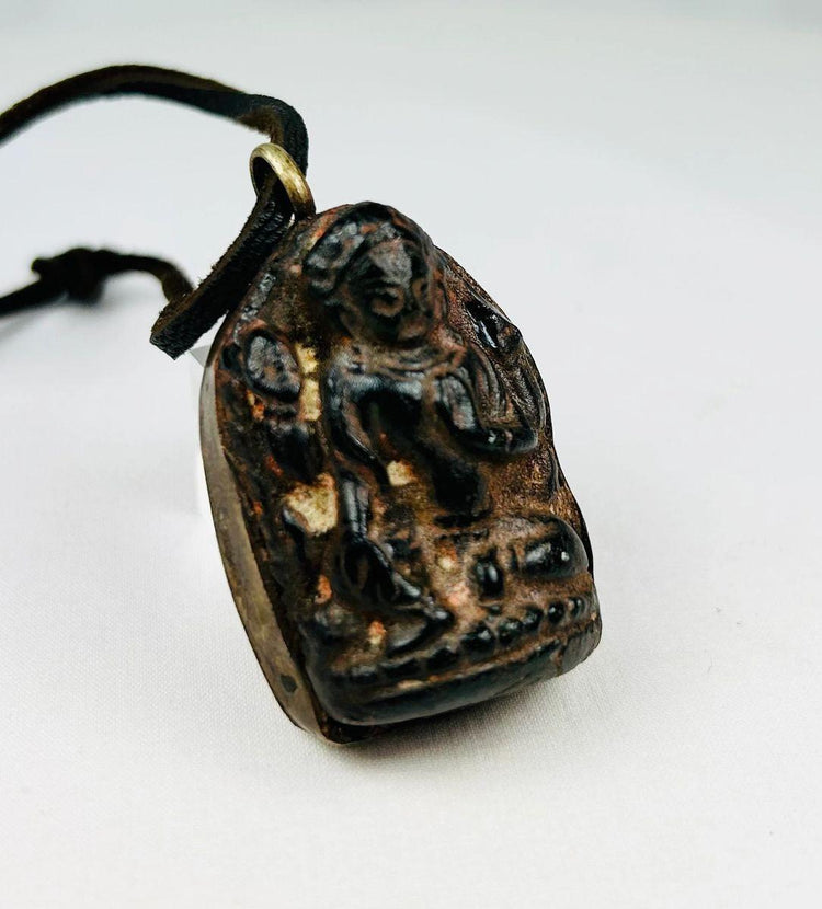 Bronze Buddha reliquary pendant with original leather cord and patina