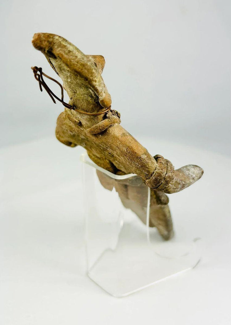 Rear view highlighting hand-modeled construction of a Mesoamerican terracotta figure