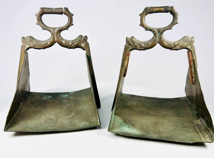 Equestrian stirrups with symbolic serpent motifs representing protection