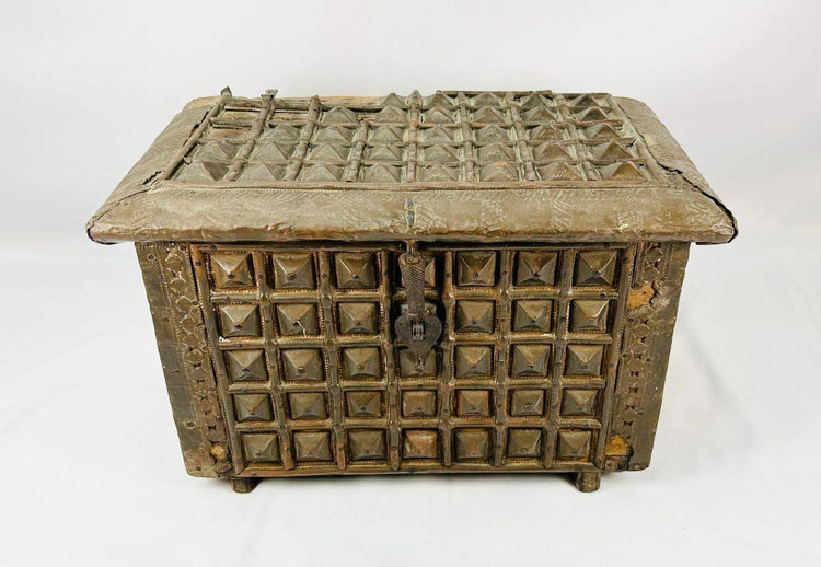 Antique Indian wooden box featuring embossed geometric and pyramid designs