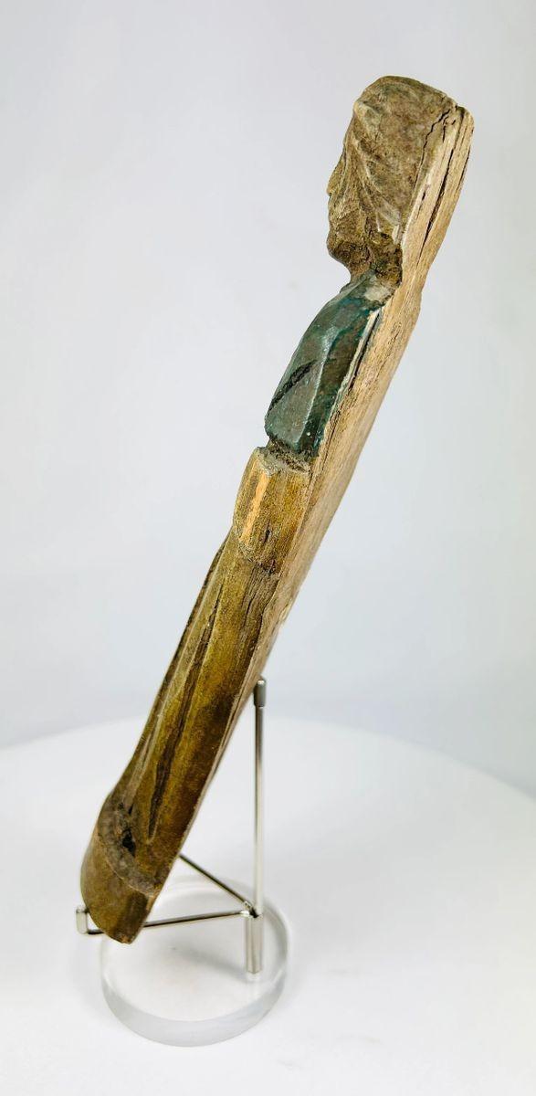 Side view of antique European wooden folk art sculpture with natural wear and patina.