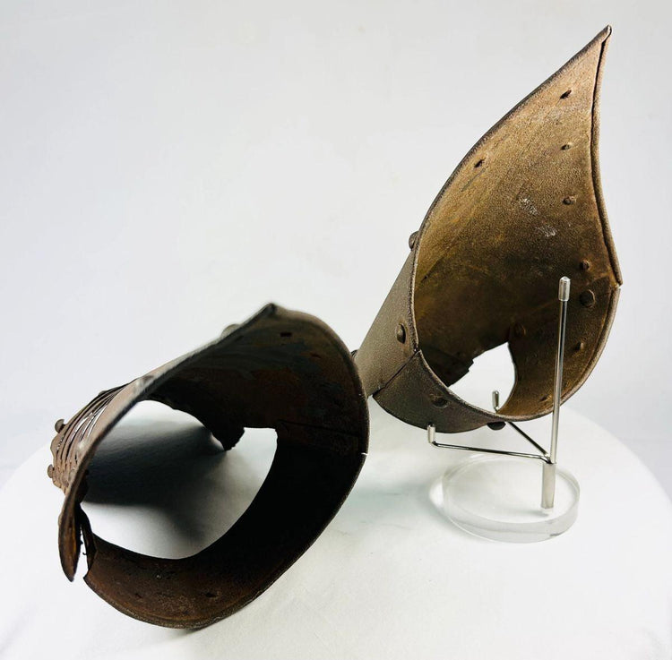 Top-down photo of Gothic armor gauntlets showing finger plate construction.