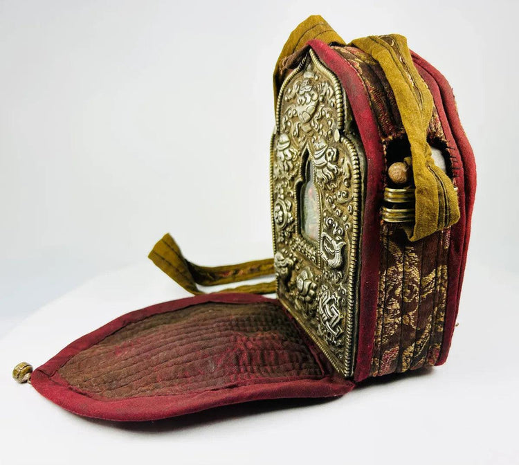 Antique Tibetan gau amulet box with lotus, endless knot, and Buddha figure