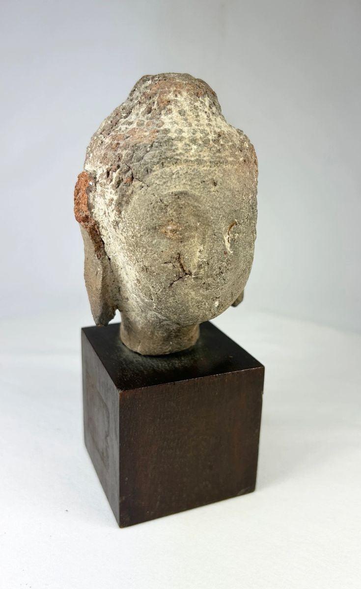 Early Southeast Asian Buddha head sculpture in terracotta with natural aged patina