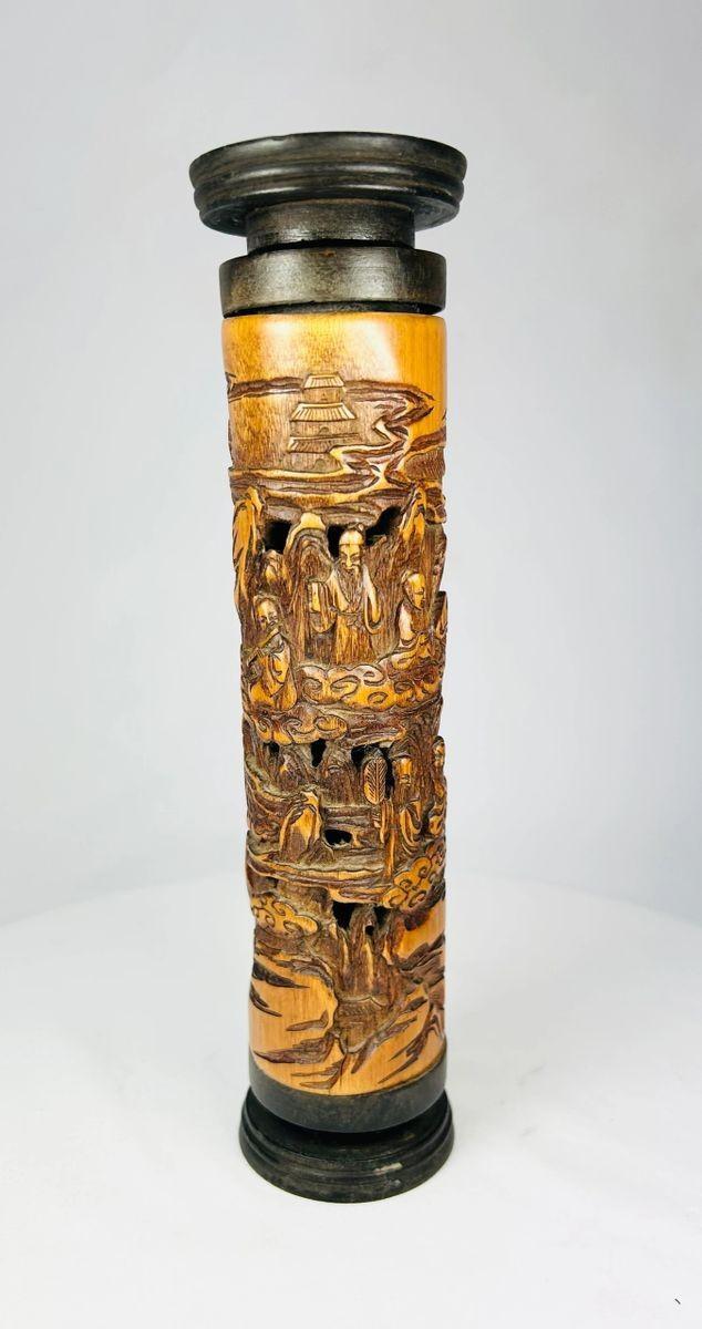 Museum-style photo of an intricately carved Chinese boxwood incense holder