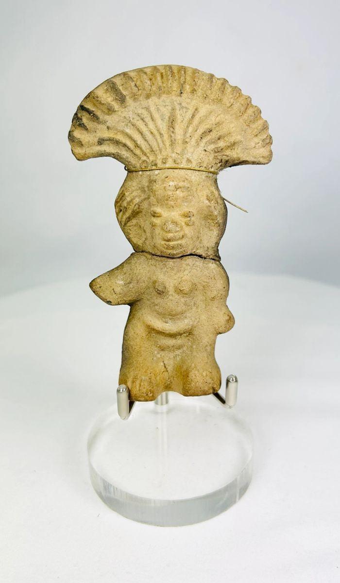 Detail view of the ceremonial fan-shaped headdress on a Mesoamerican terracotta figurine