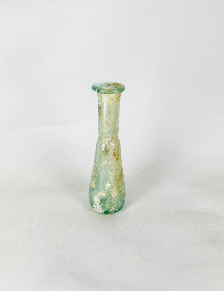 1st BCE–4th CE Roman hand-blown glass bottle reflecting luxury trade and daily life