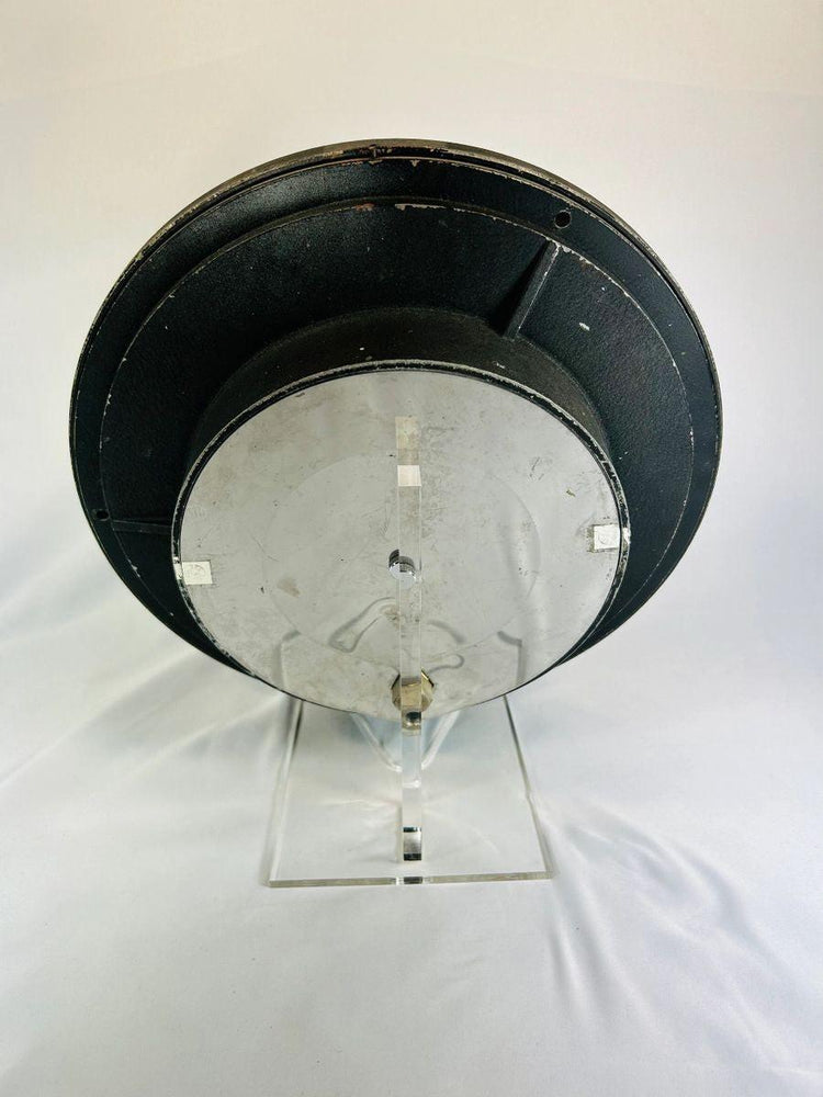 Rear view of authentic NASA Space Shuttle low-pressure gauge, mid-1980s, showing metal casing and mounting hardware used in ground support systems for shuttle pre-launch operations.