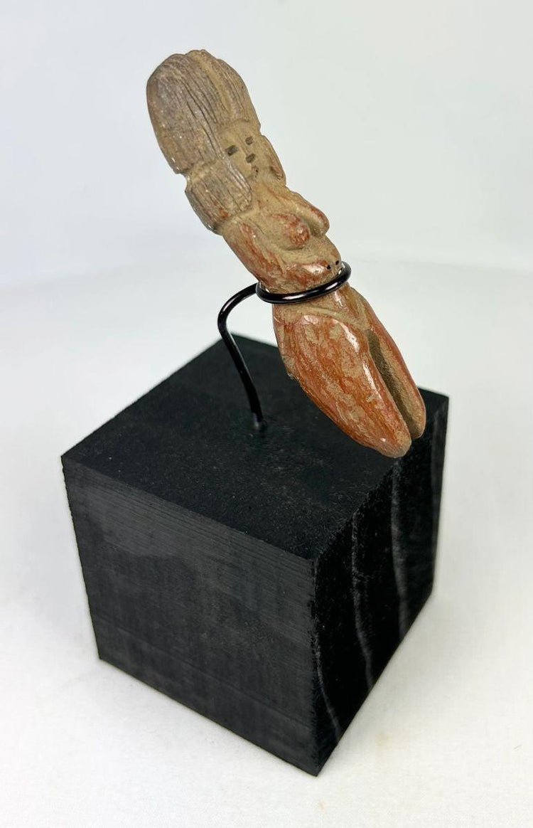 Veracruz culture terracotta figurine with raised hands and symbolic fertility form