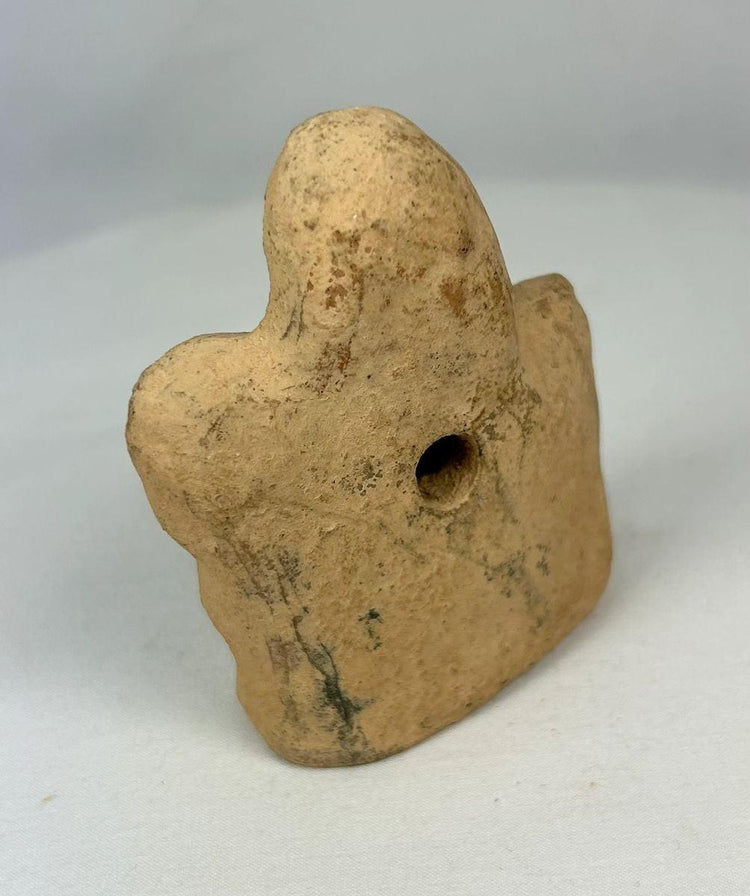 Rear and side profile of terracotta equestrian figurine showing body proportion and patina.