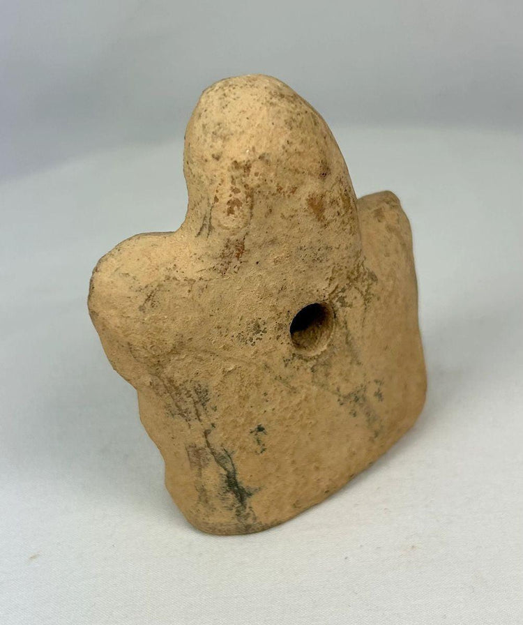 Rear and side profile of terracotta equestrian figurine showing body proportion and patina.