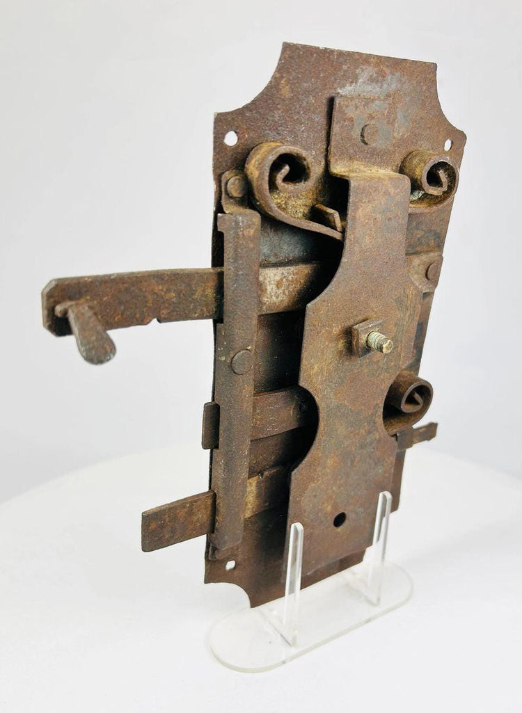 European blacksmith-made iron lock featuring robust design and period wear