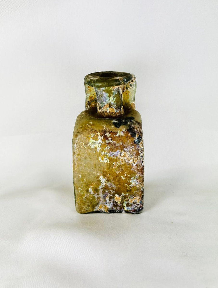 Ancient Roman glass vessel with wide ribbed “celery handle” and maker’s mark